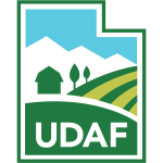 Utah Department of Agriculture and food logo has the outline of the state of utah with a barn and fields drawn inside of it.