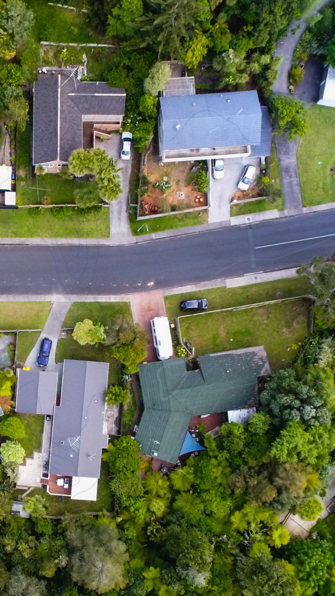 Aerial view of houses on a suburban street.
